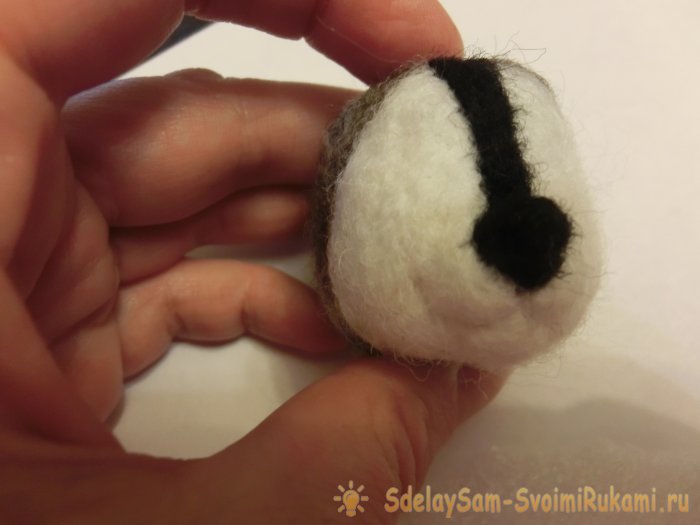 Валяный енот из шерсти
